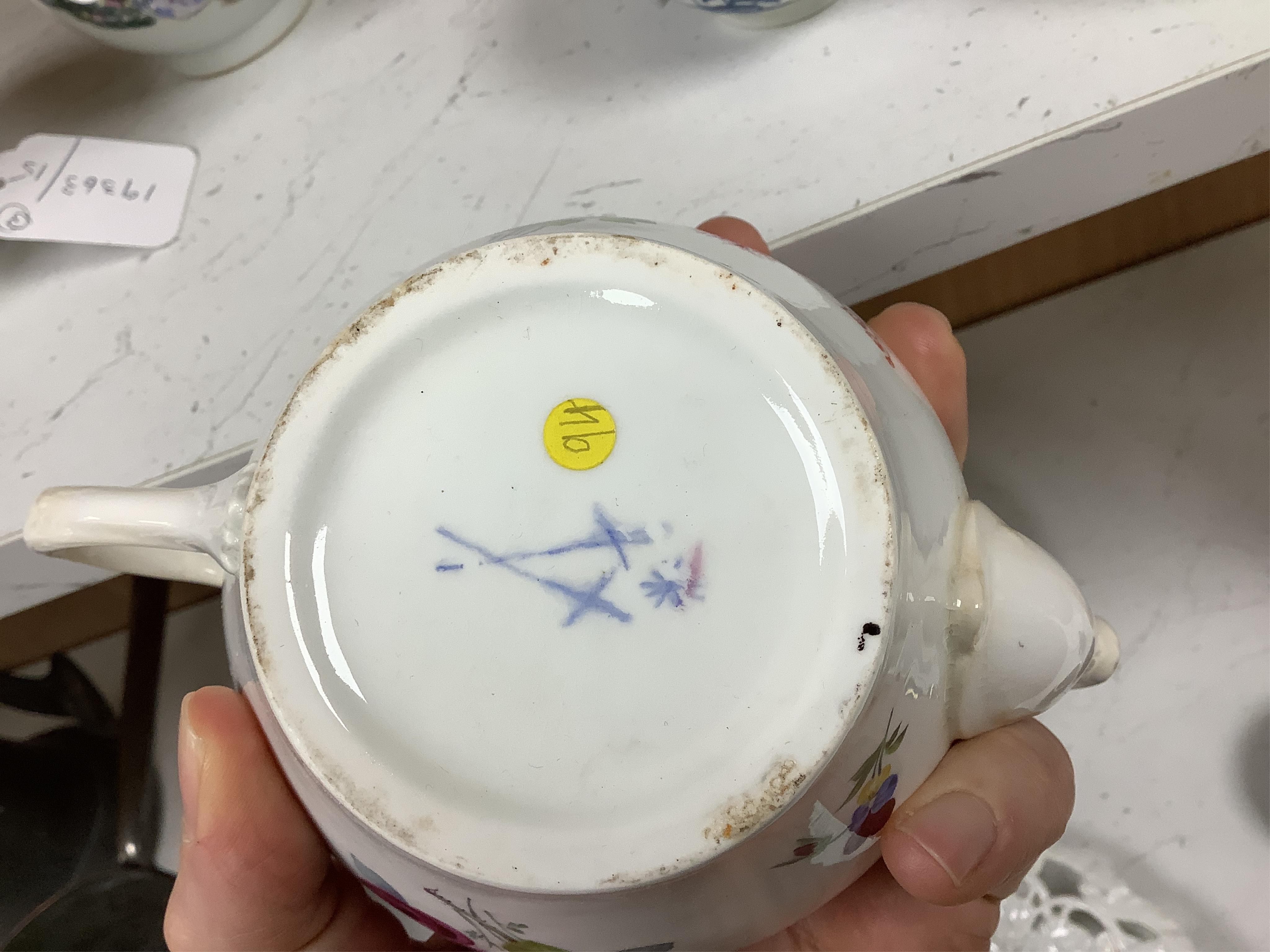 An 18th Furstenburg porcelain teapot and cover, a Wallendorf porcelain teapot and cover and a Meissen style teapot, 12cm high